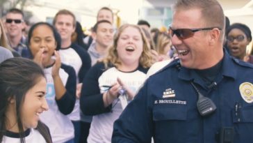 Massive mob overwhelms school's favorite police officer!